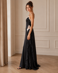 Side view of black lace trim satin-look slip maxi dress with cascading side ruffles