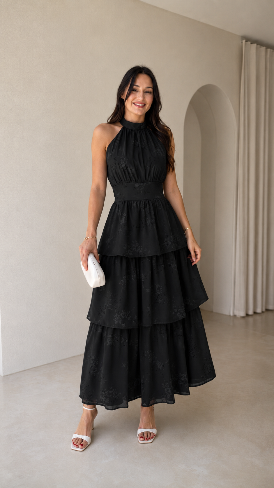 Black halter tiered maxi dress shown from the front