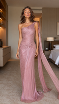 Front view of dusty rose one-shoulder pleated evening gown with long draped shoulder sash