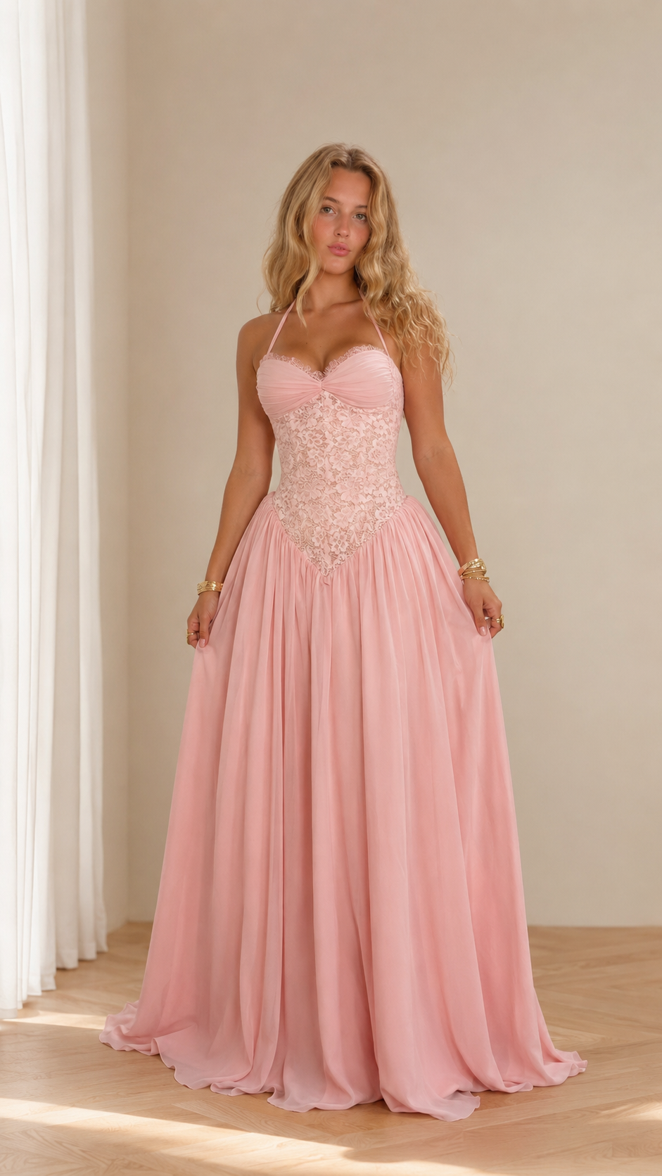 Front view of blush pink lace corset halter floor-length prom dress