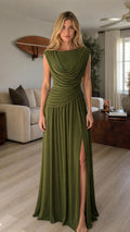 Front view of model wearing olive green draped cowl neck maxi dress with slit