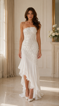 Front view of ivory strapless beaded high-low mermaid evening dress