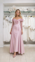Model wearing pink off-the-shoulder evening dress, front view