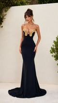 Front view of black strapless mermaid evening gown with gold embellished sweetheart neckline