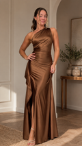 Front view of chocolate one-shoulder satin-like maxi evening dress with draped ruffle and front slit