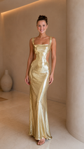 Front view of champagne sequin cutout mermaid maxi evening dress