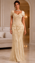 Champagne embroidered mermaid evening gown with floral appliqué and fringe short sleeves front view