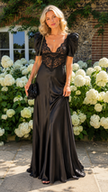 Front view of black lace bodice satin-look maxi dress with puff sleeves