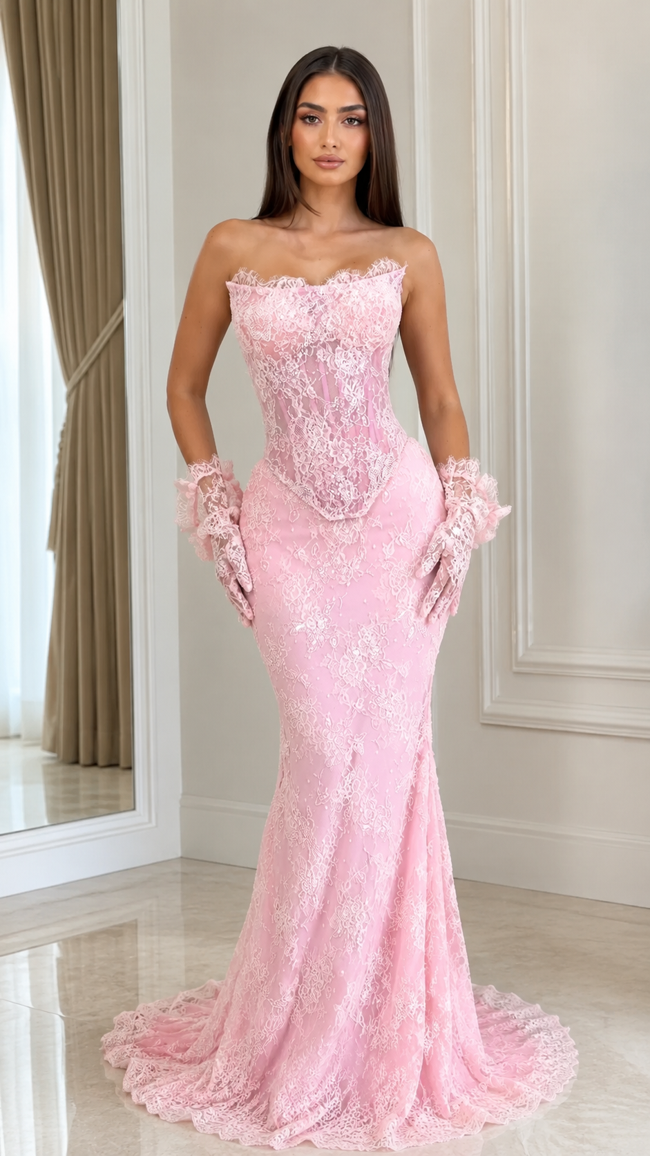 Front view of blush pink strapless lace mermaid evening gown with sheer corset bodice and matching lace wrist accessories