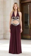 Model wearing burgundy halter two-piece maxi dress front view