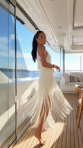 Ivory fringe halter maxi dress with side view and flowing fringe movement