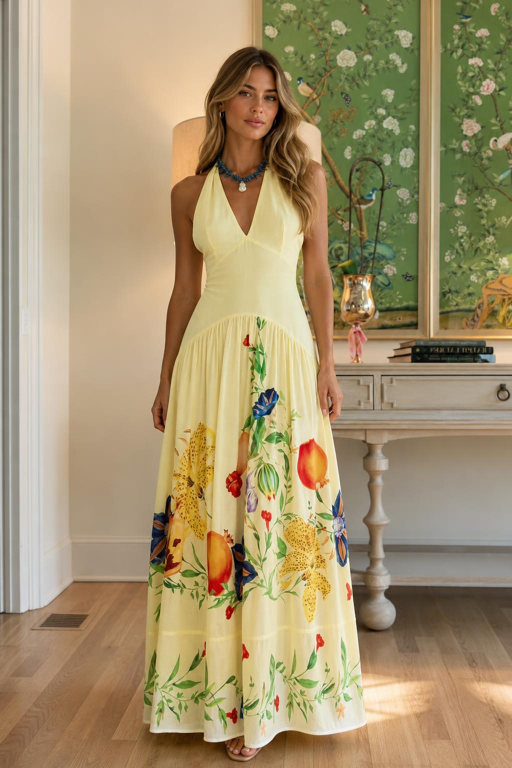 Front view of yellow halter neck floral maxi dress