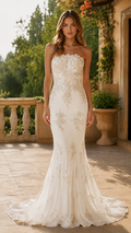 Front view of ivory strapless mermaid evening gown with lace appliqué-style detailing and train