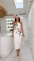 Front view of white strapless midi bodycon dress with pink floral embroidery and vine detail