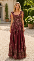 Model wearing a burgundy floral tie-shoulder square neck maxi dress