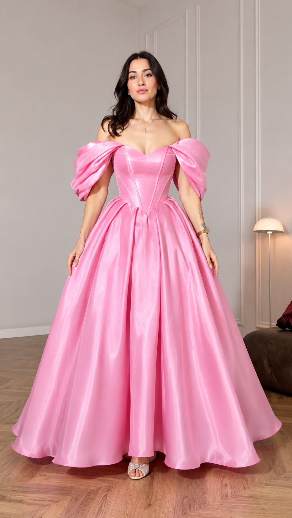 Front view of pink off shoulder ball gown with puff sleeves and full floor-length skirt