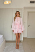 Model wearing pink long sleeve mini dress from the front