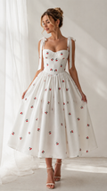 Front view of white cherry print tie-strap sweetheart midi dress with full skirt