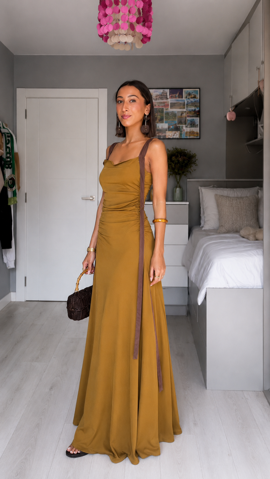 Angled front view of mustard floor-length ruched maxi dress with long contrast straps