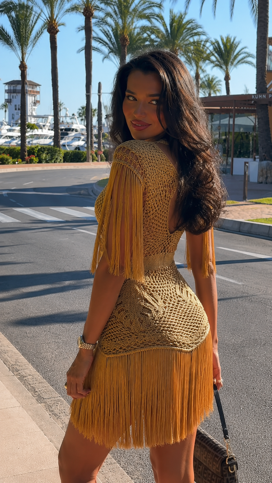 Camel crochet fringe mini dress back view with tassel sleeves and fringe skirt