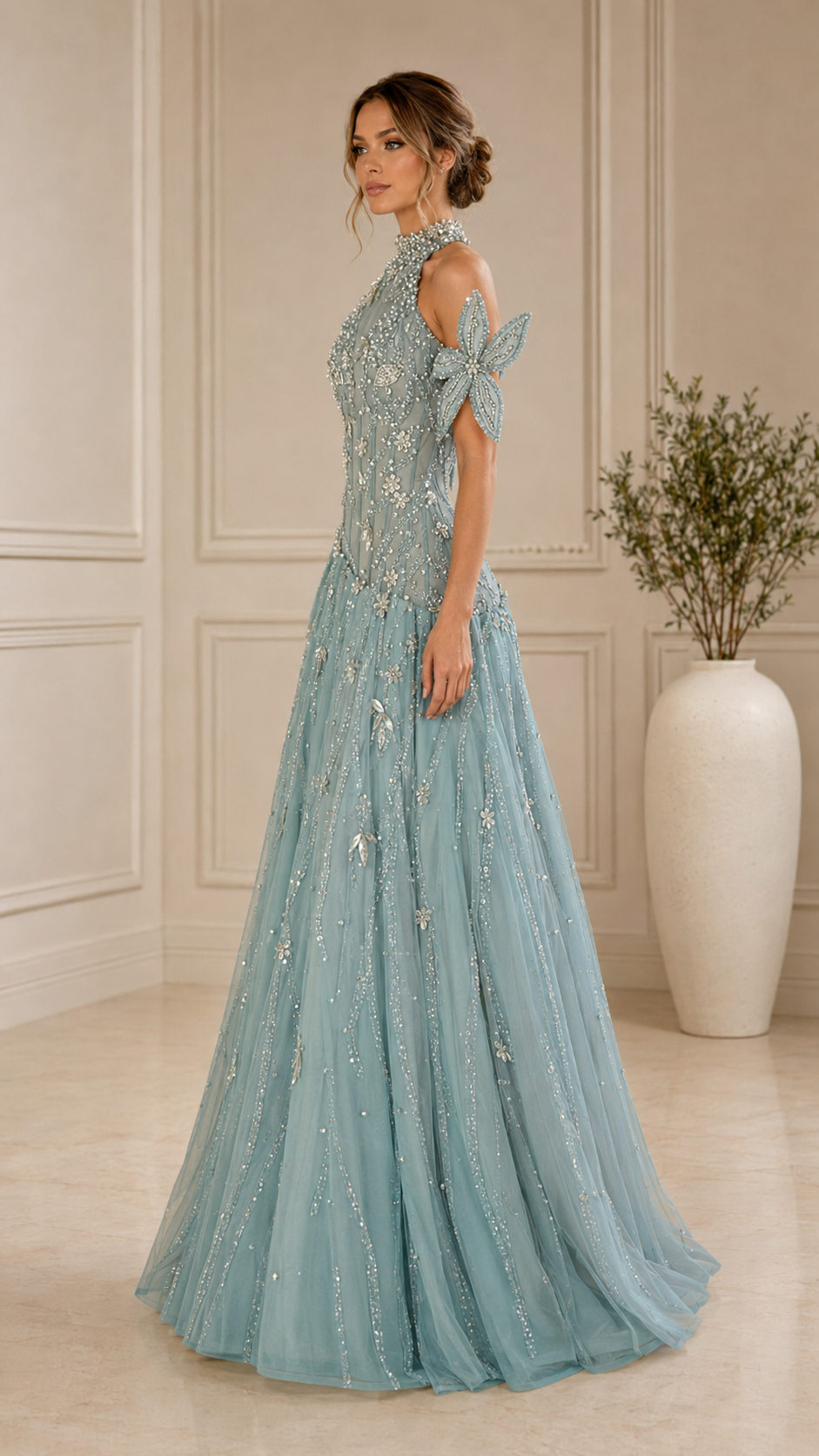 Side view of dusty blue floor-length A-line formal gown with sparkling embellishment