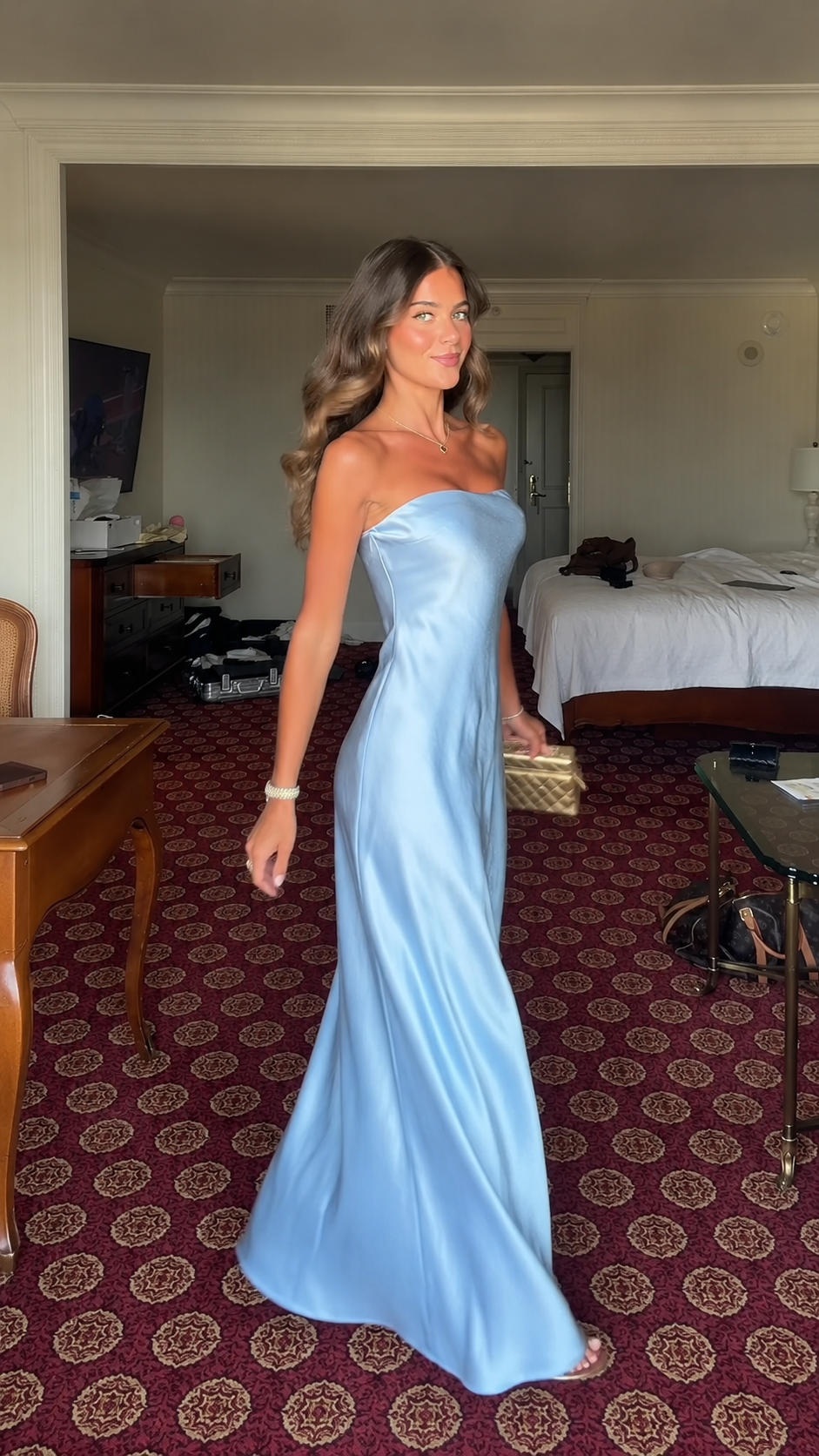 Angled front view of sky blue strapless satin-look maxi dress