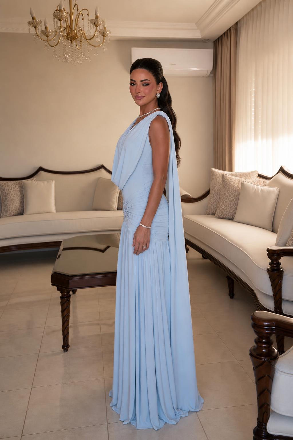 Side profile view of Light Blue draped cape dress