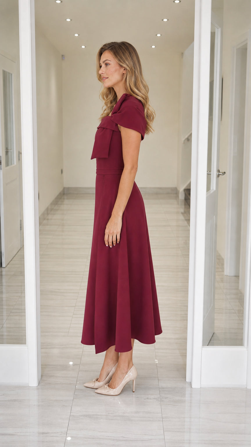 Side profile view of burgundy midi dress