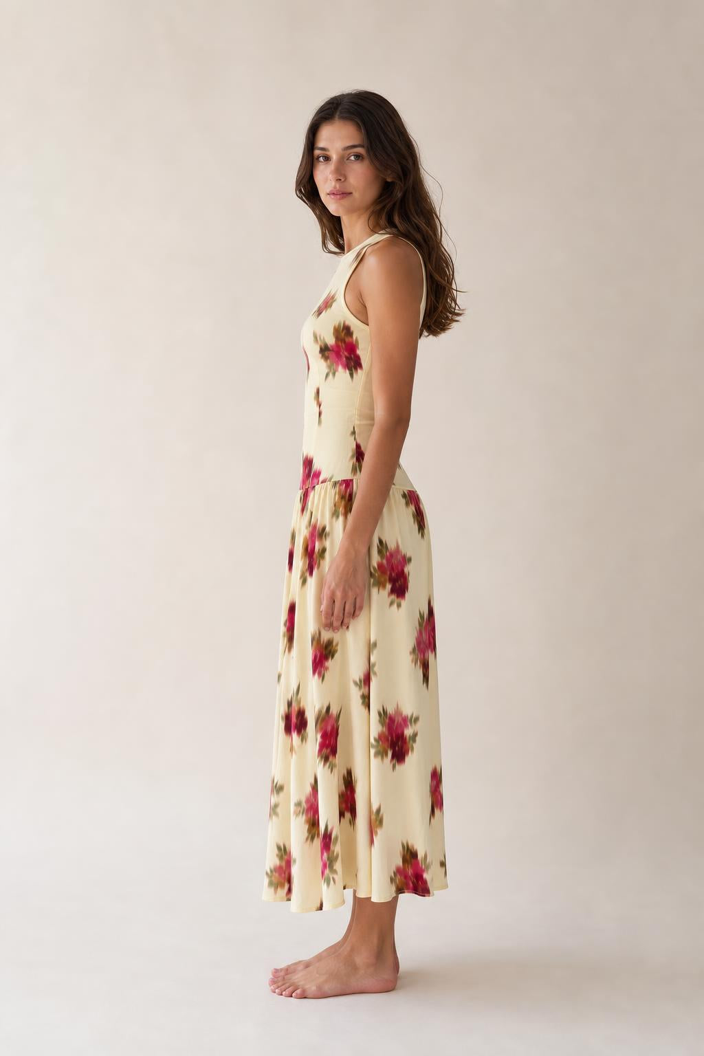 Side profile view of woman in Floral Cream midi dress