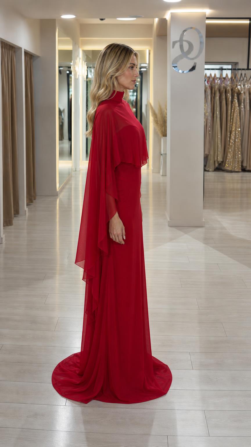 Side profile view of red cape evening gown