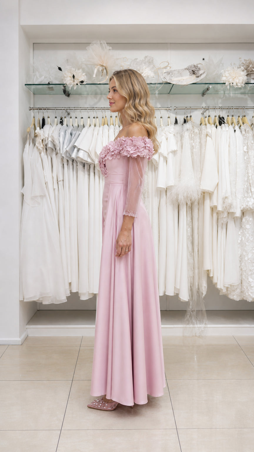 Model wearing pink evening gown, side view