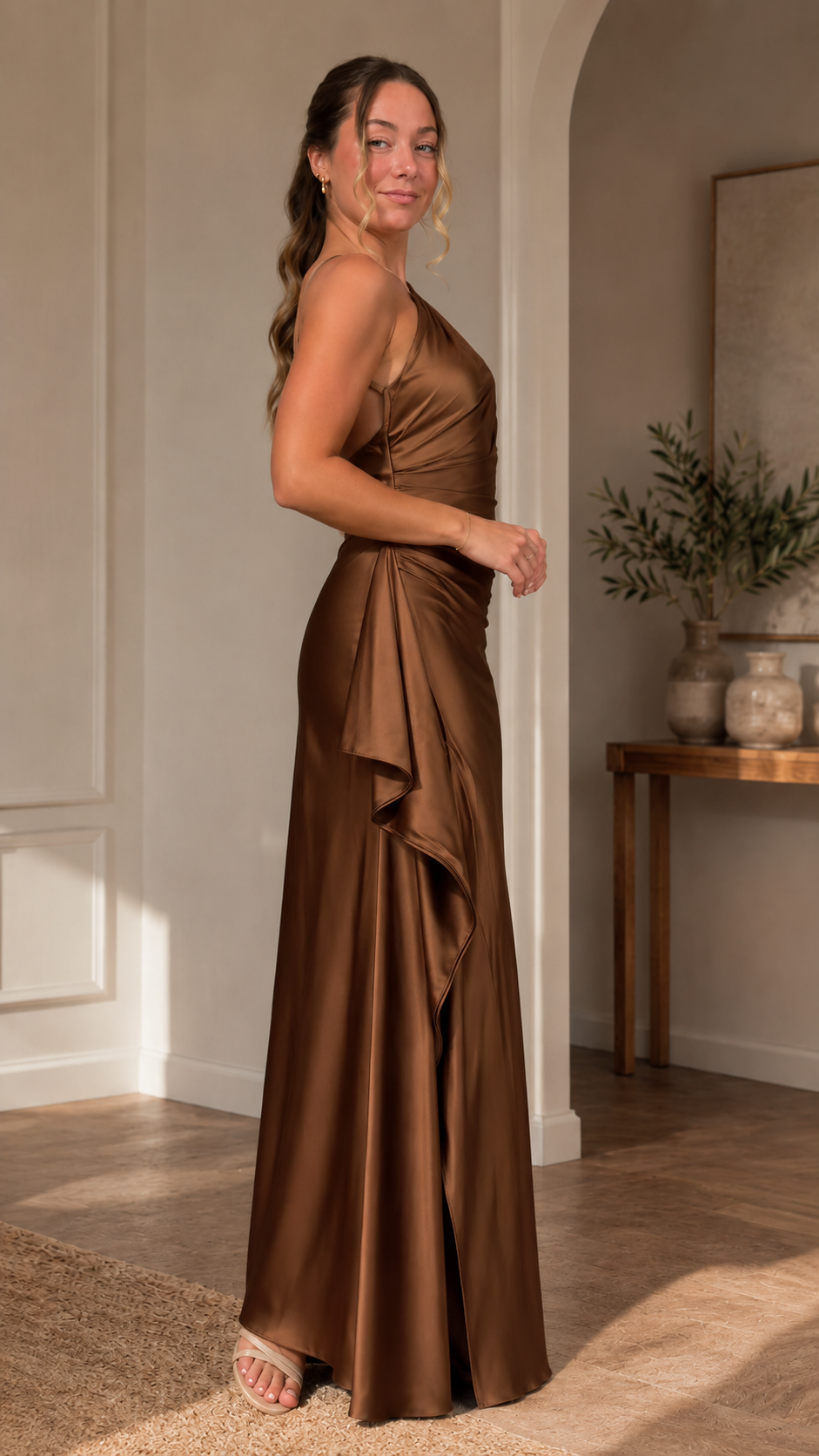 Side view of chocolate asymmetric one-shoulder formal maxi dress with cascading side drape