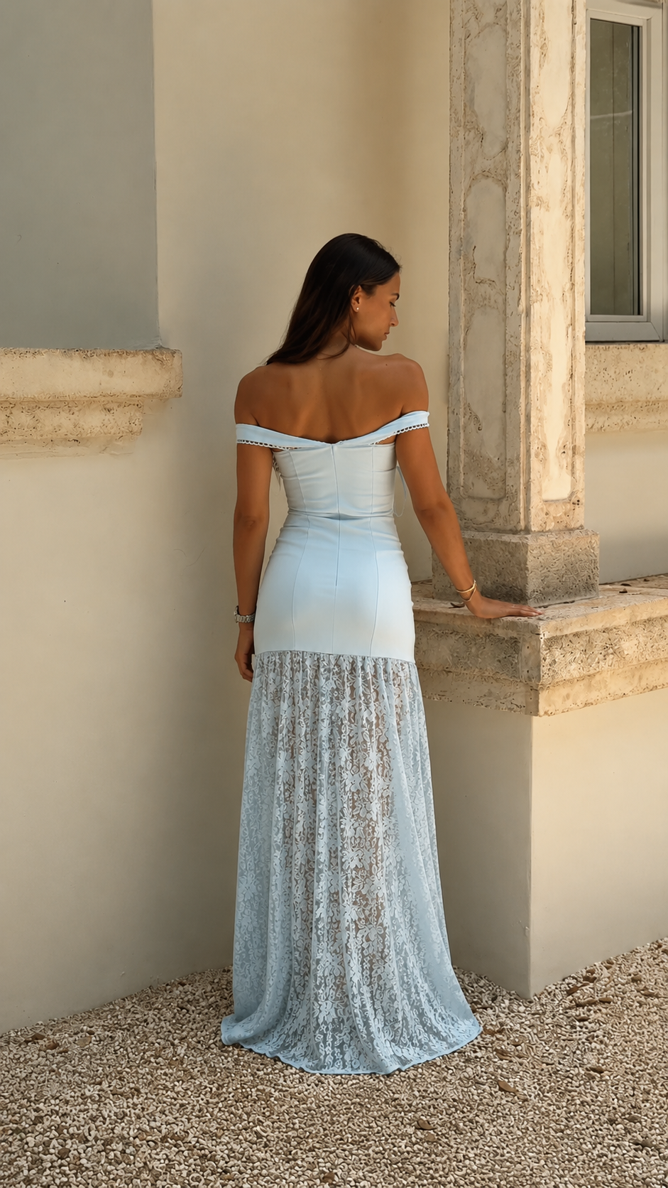 Back view of powder blue off-shoulder fitted maxi dress with flowing lace-look skirt