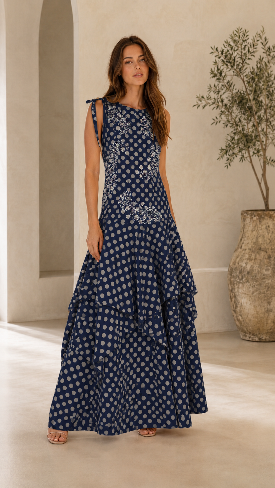 Front view of navy embroidered polka dot tiered maxi dress