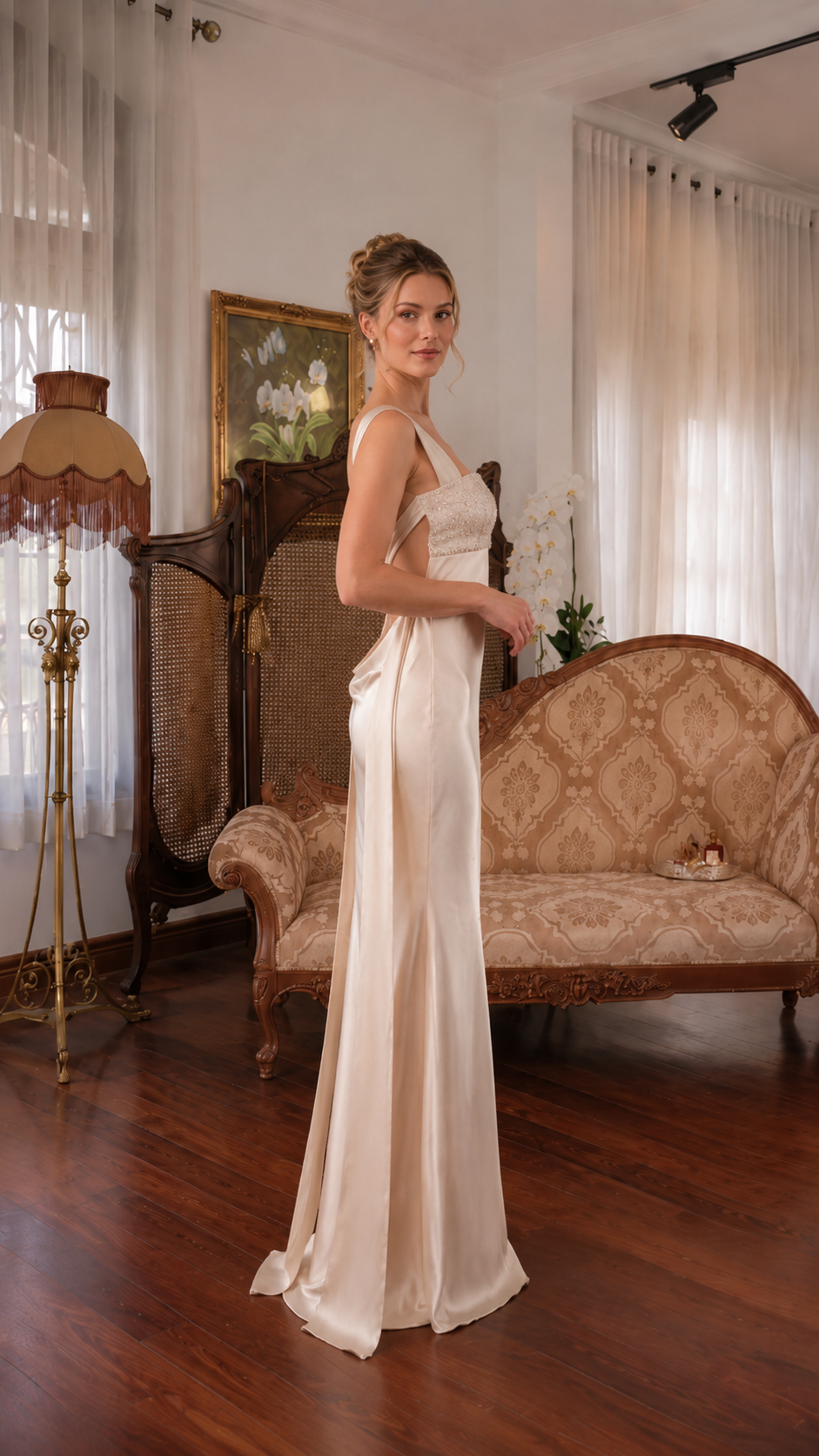 Side view of ivory floor-length satin-look gown with wide straps and slim silhouette