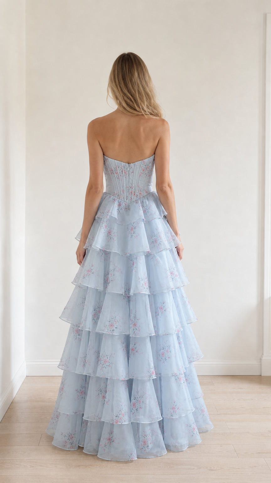 Back view showcasing structured corset back of light blue gown