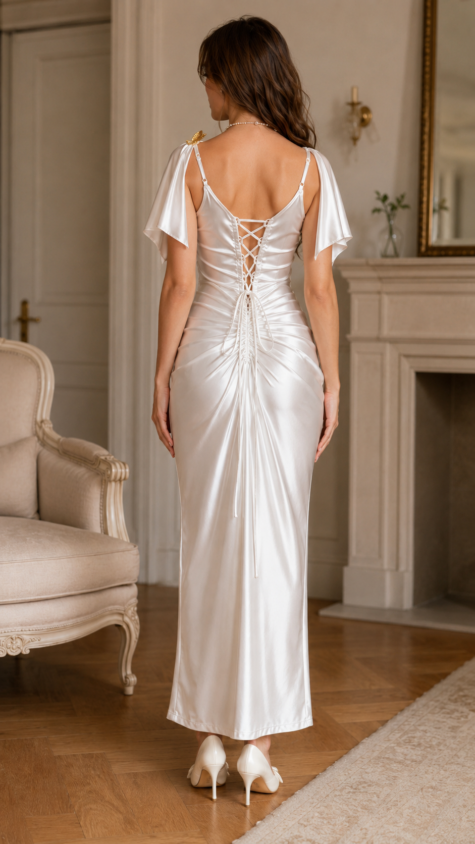 Back view of ivory satin-look maxi dress with back lace-up detail and flutter sleeves