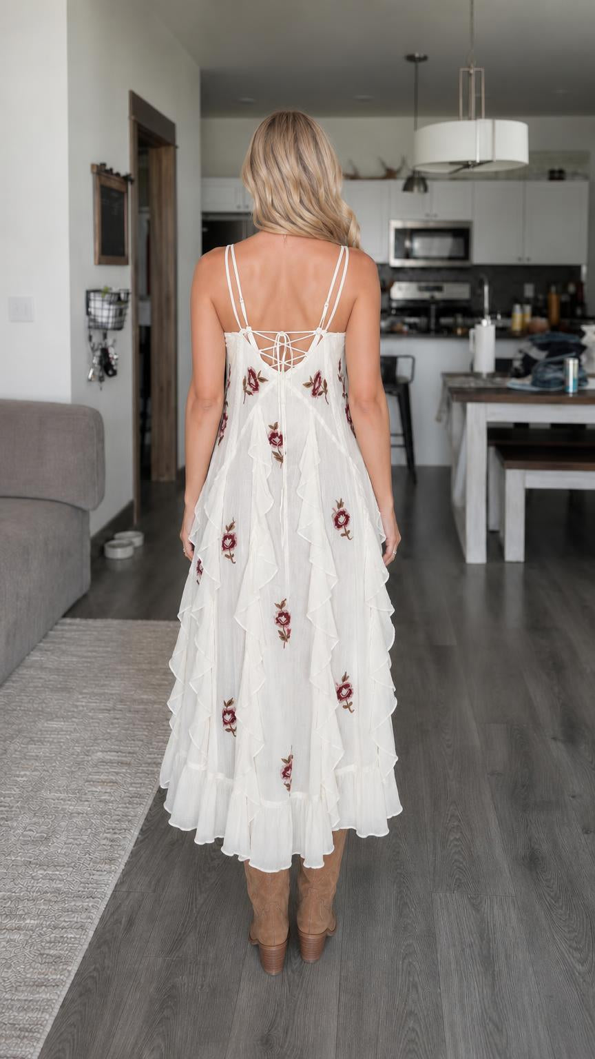 Model wearing white ruffle hem dress back view showing lace-up detail
