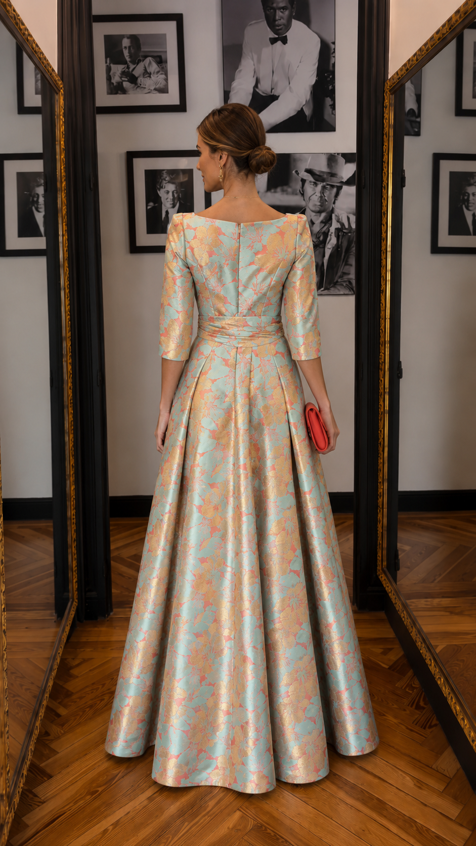 Back view of aqua and peach floral jacquard evening gown with fitted waist and sweeping skirt