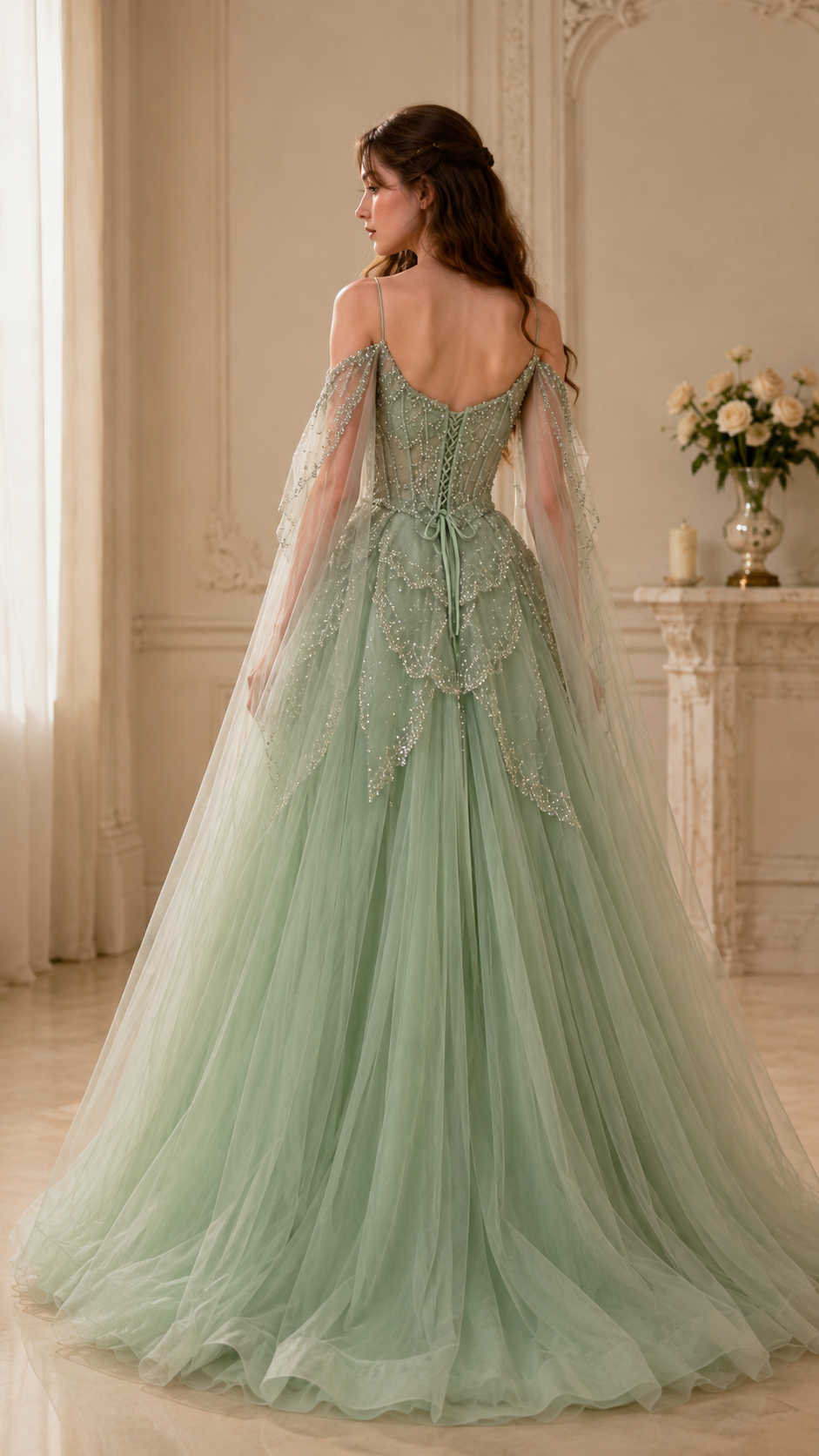 Back view of sage floor-length tulle evening gown with low back and sweeping hem