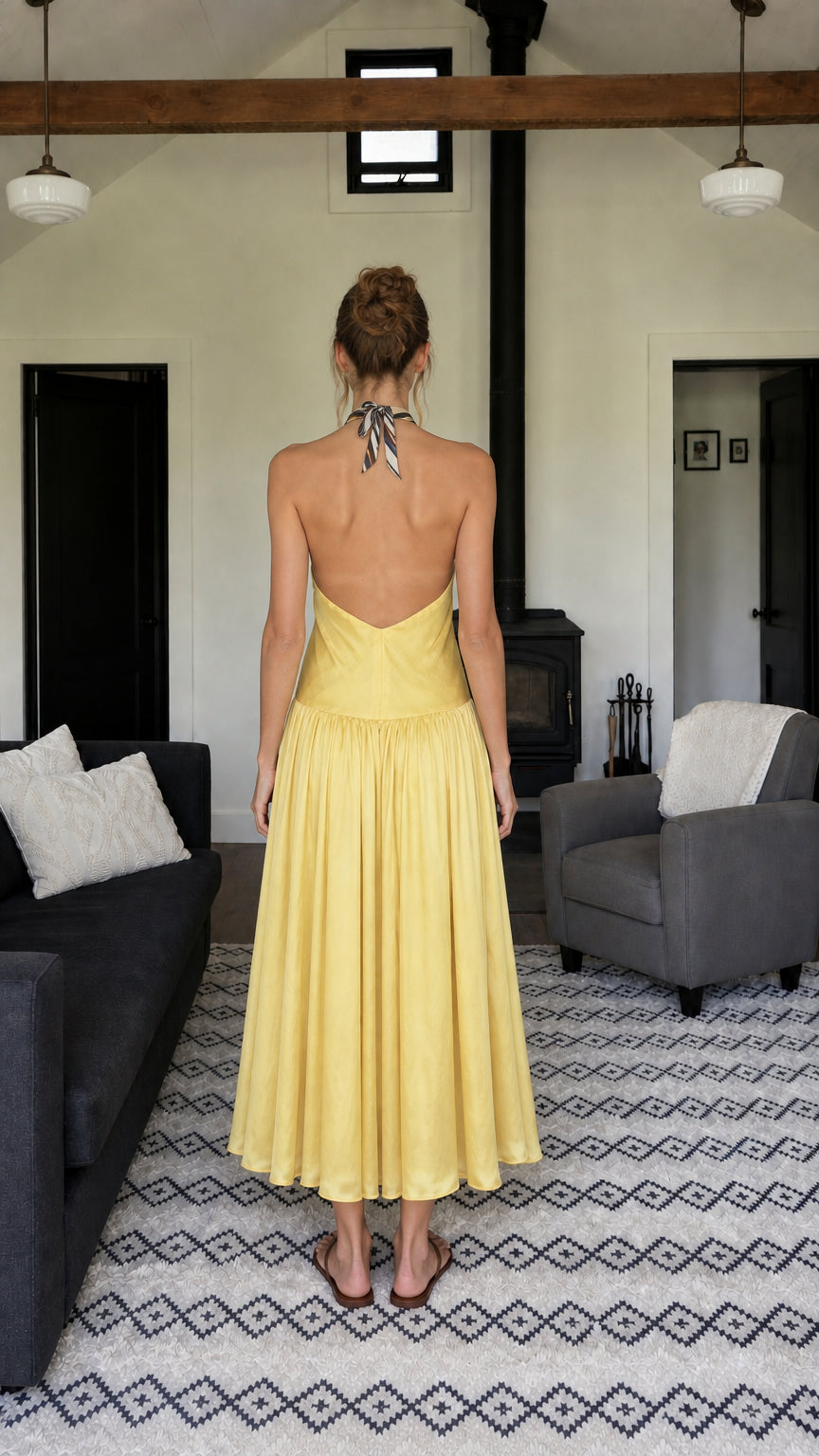 Back view of woman showing open-back halter design