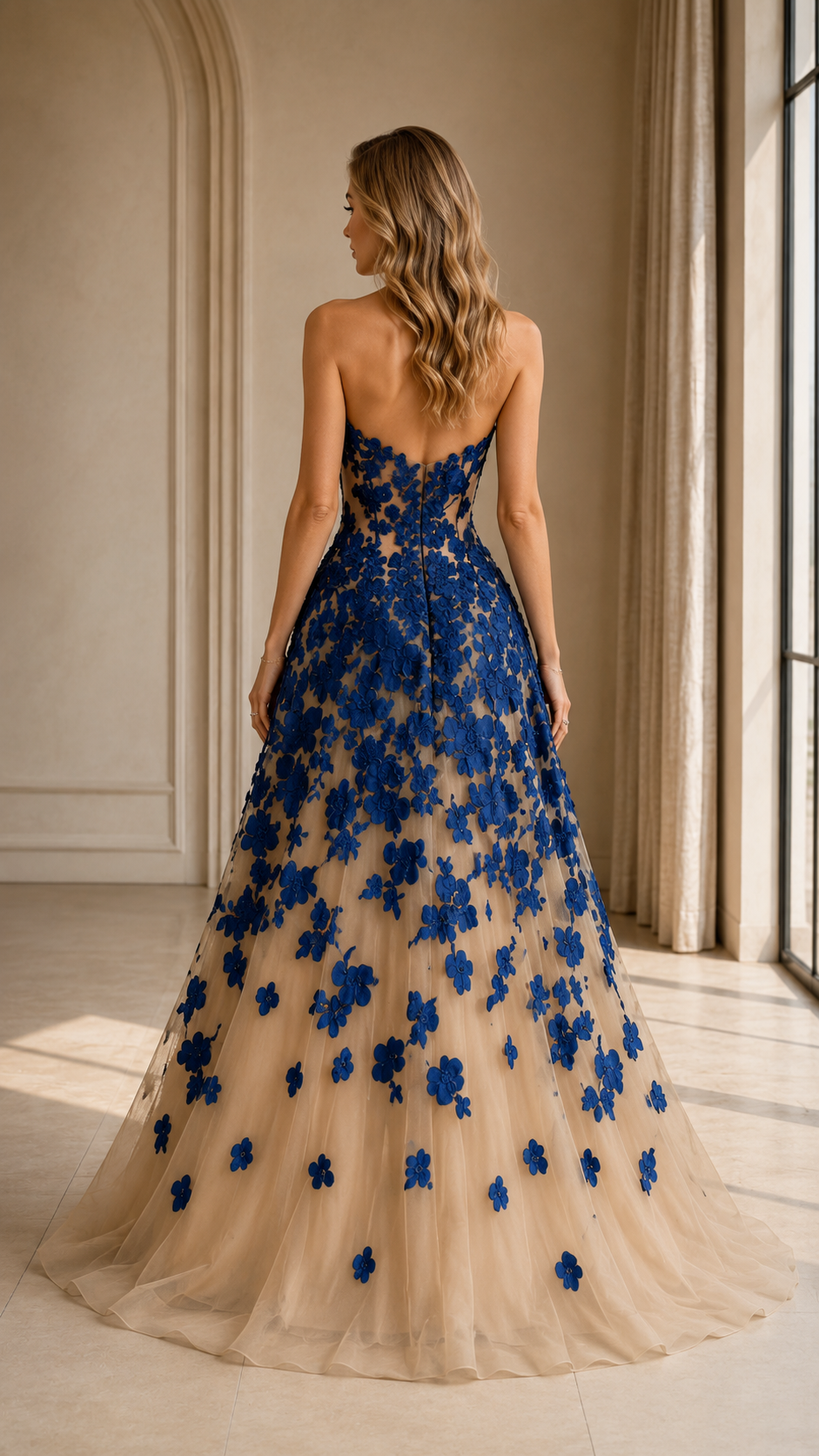 Back view of royal blue floral appliqué floor-length evening gown