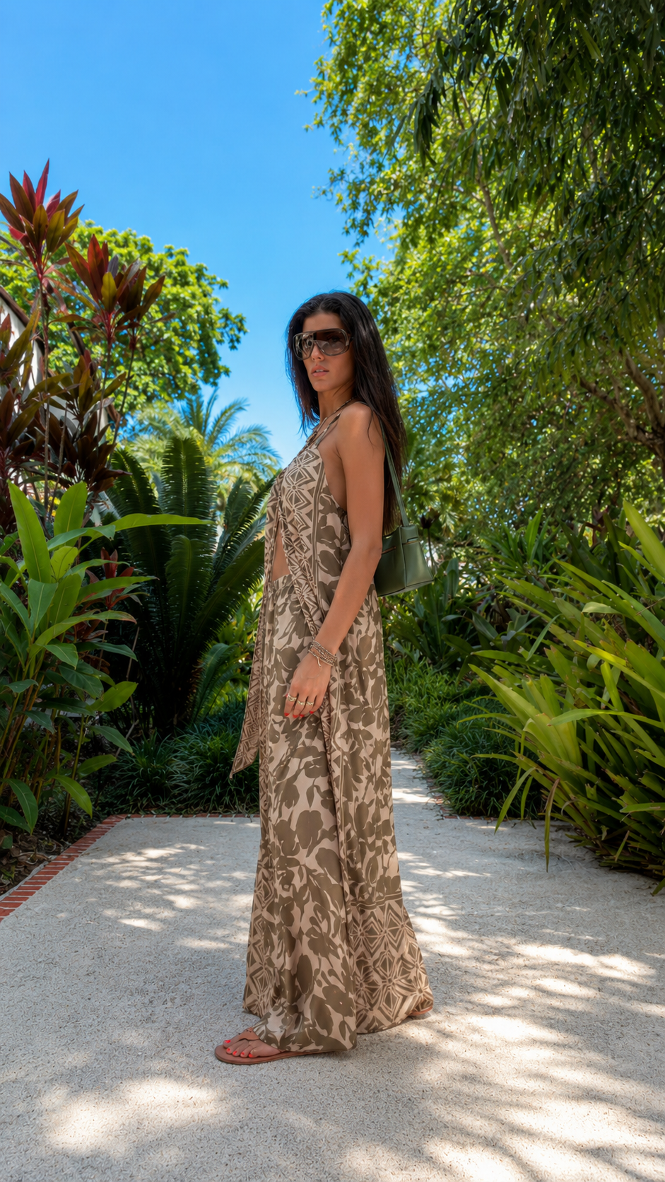 Side view of taupe halter top and wide leg pants set with matching long duster panel