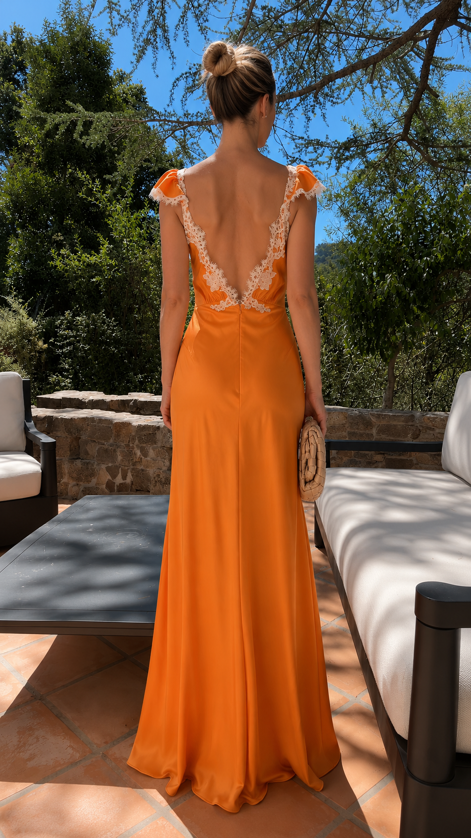 Back view of orange maxi dress with low open back and lace trim