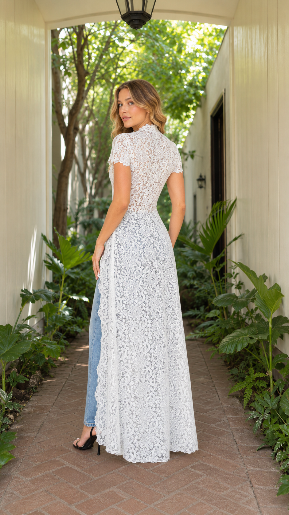 Back view of white floral lace fitted maxi top with high neckline and long hem