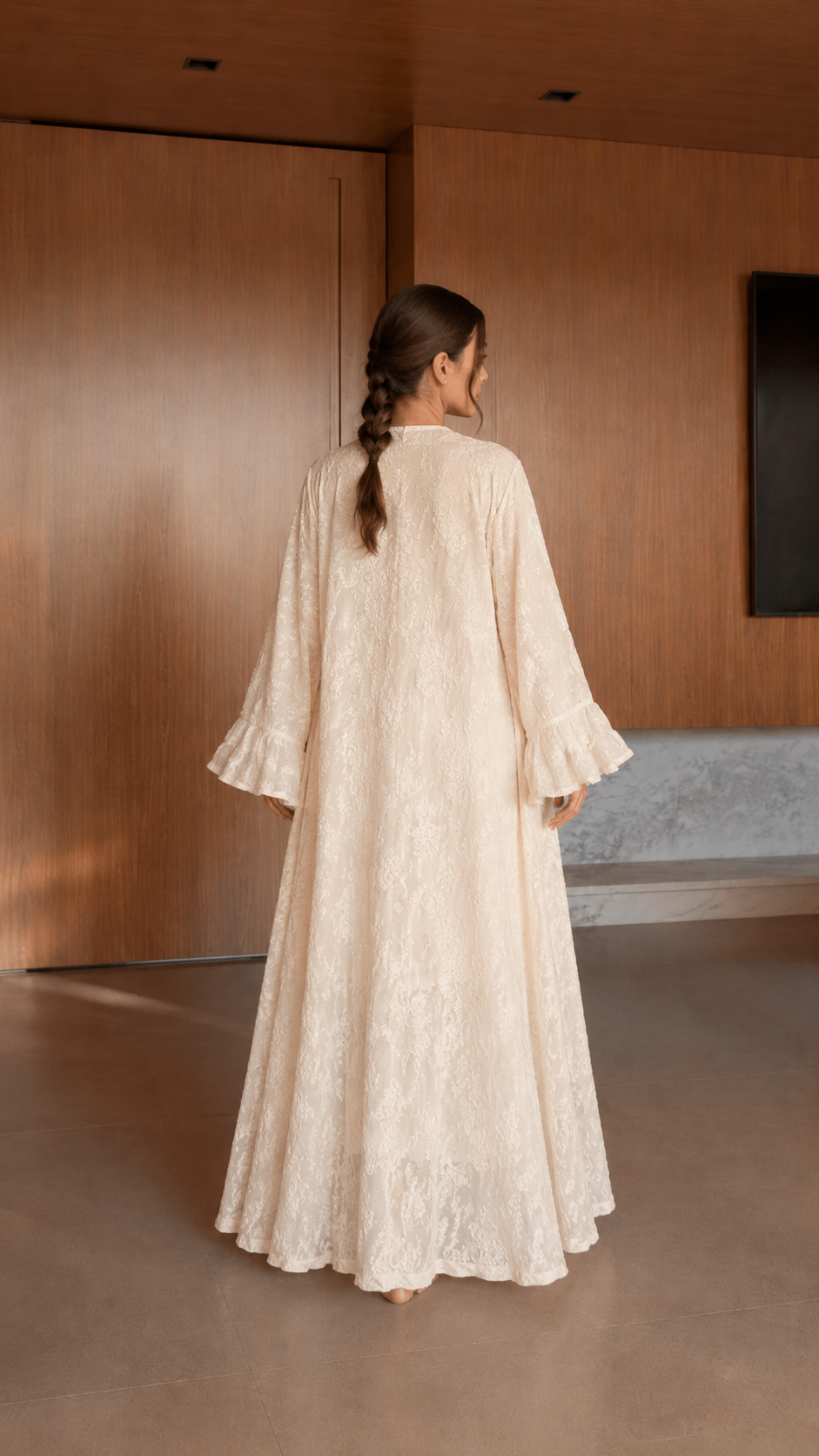 Back view of ivory long duster from matching textured skirt set