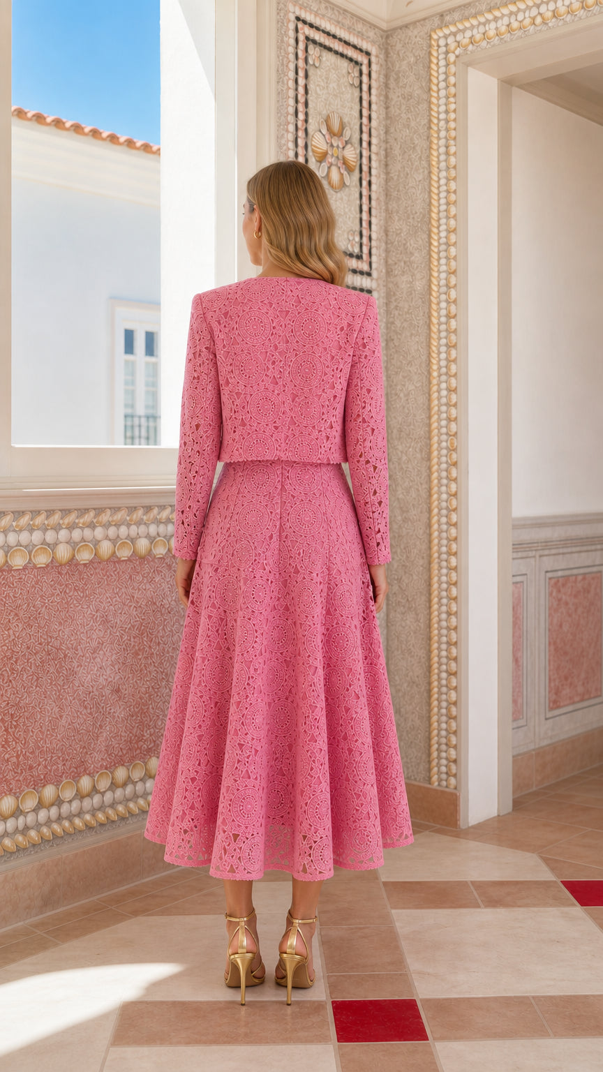Back view of woman wearing pink lace crop jacket and midi dress