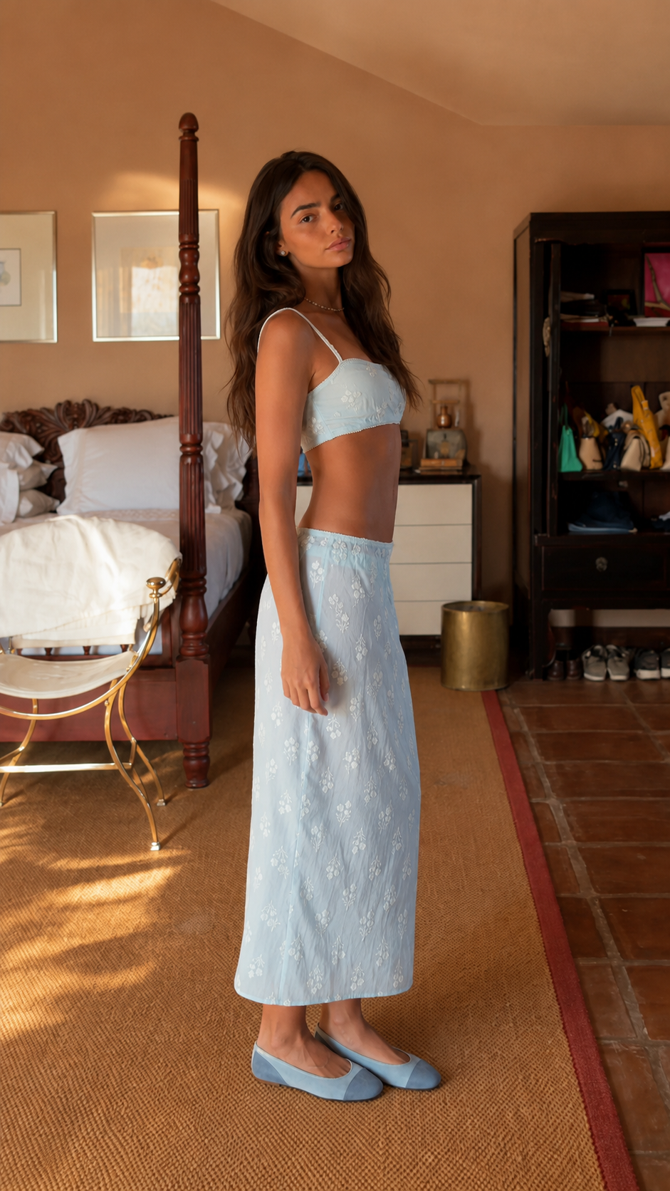 Side view of powder blue spaghetti-strap crop top and embroidered maxi skirt