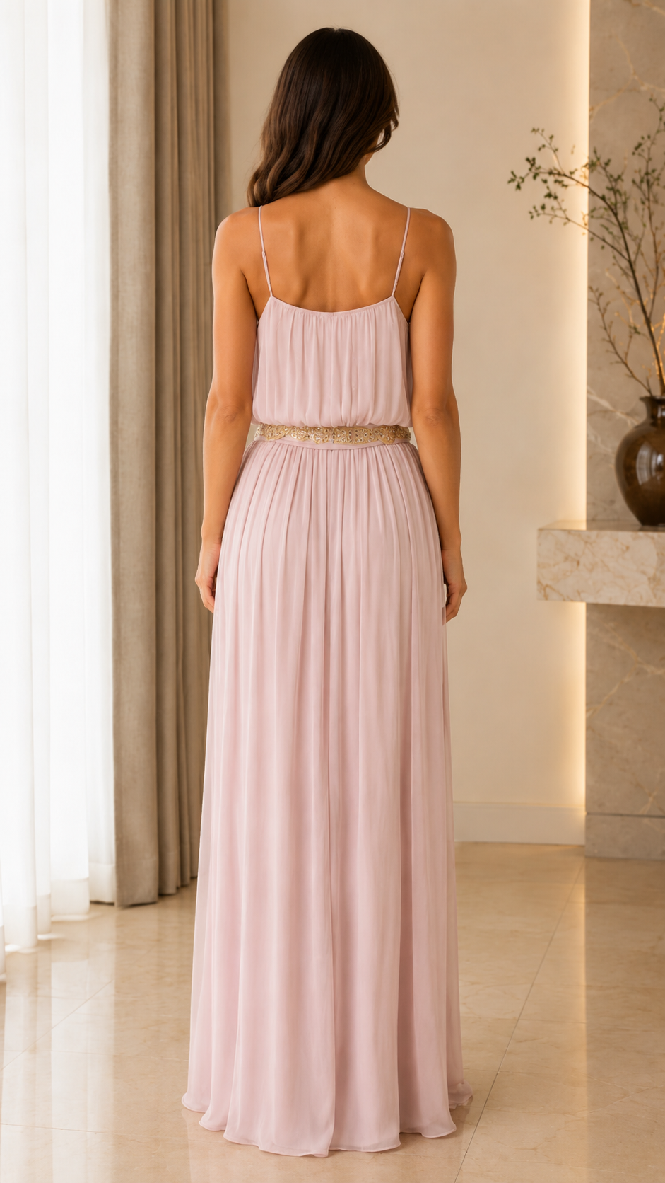 Back view of blush pink sleeveless maxi dress with slim straps and full-length skirt