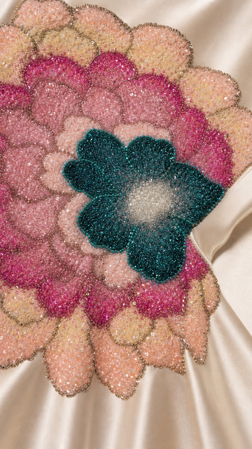 Close-up detail of beaded floral applique bodice